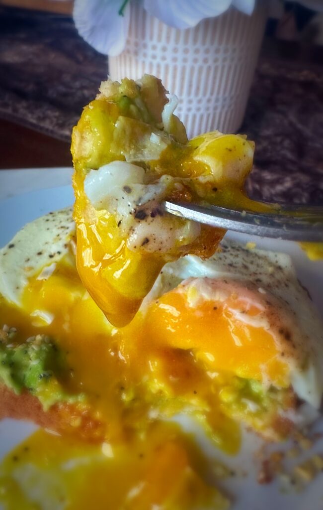 Gooey over easy egg with avocado toast